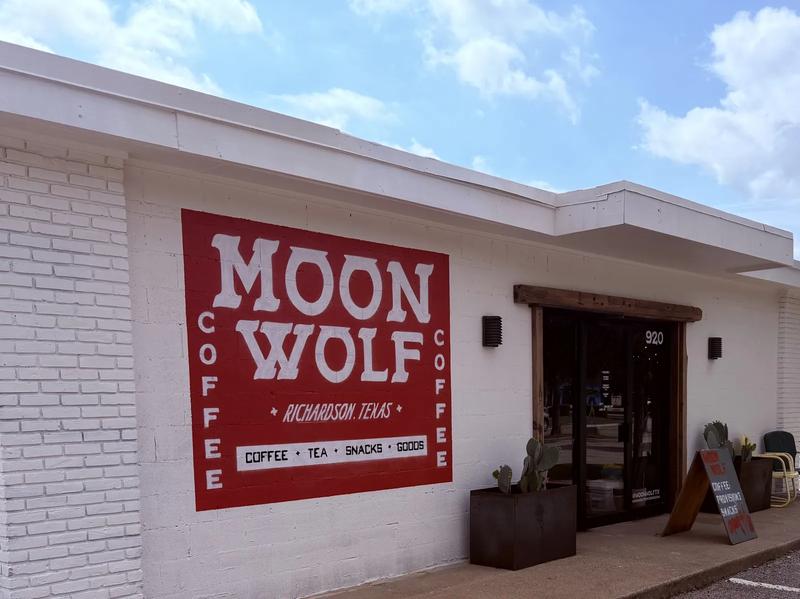 Moon Wolf storefront in daylight — red panel hand-painted MOON WOLF · Richardson, Texas · Coffee · Tea · Snacks · Goods Moon Wolf storefront in daylight — red panel hand-painted MOON WOLF · Richardson, Texas · Coffee · Tea · Snacks · Goods